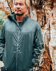 Men’s packable waterproof wind and rain jacket in Lunar Rock for tropical travel
Lightweight rain jacket folded and packed — travel essential outerwear
Waterproof jacket shown on model — windproof rain protection for outdoor adventure
Rain jacket with packable design — perfect for beach travel and unpredictable weather
